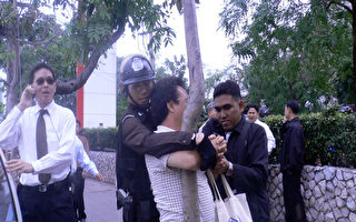 中共指使泰国警察殴打拘押法轮功学员