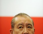 东亚银行主席李国宝因道琼斯内幕交易案2月16日辞去行政会议非官守成员一职(AFP/MIKE CLARK)