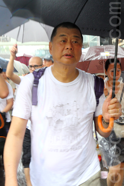 黎智英去年与李柱铭一起参加七一大游行。(大纪元资料图片) 黎智英去年与李柱铭一起参加七一大游行。(大纪元资料图片)