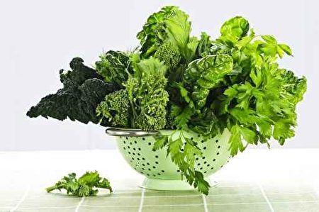 Dark green leafy vegetables in colander Dark green leafy vegetables in colander