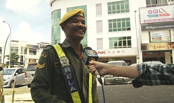 志願警衛隊隊員Yusni。(新唐人視頻截圖) 志願警衛隊隊員Yusni。(新唐人視頻截圖)