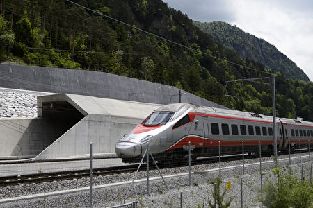 An Italian train makes its way at the north entrance of the new Gotthard Base Tunnel the world's longest train tunnel on the eve of its opening ceremony on May 31, 2016 in Erstfeld. The new Gotthard Base Tunnel (GBT) is set to become the world's longest railway tunnel when it opens on June 1.The 57-kilometre (35.4-mile) tunnel, which runs under the Alps, was first conceived in sketch-form in 1947 but construction began 17 years ago. / AFP / FABRICE COFFRINI (Photo credit should read FABRICE COFFRINI/AFP/Getty Images)