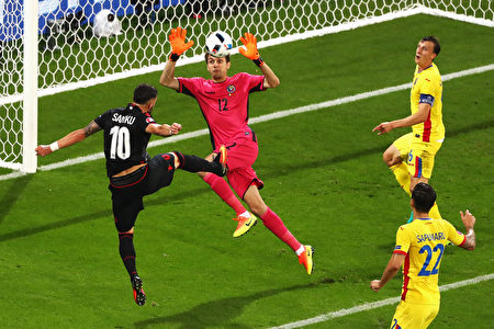 LYON, FRANCE - JUNE 19: Armando Sadiku (1st L) of Albania heads the ball to score the opening goal past Ciprian Tatarusanu (2nd L) of Romania during the UEFA EURO 2016 Group A match between Romania and Albania at Stade des Lumieres on June 19, 2016 in Lyon, France. (Photo by Julian Finney/Getty Images)