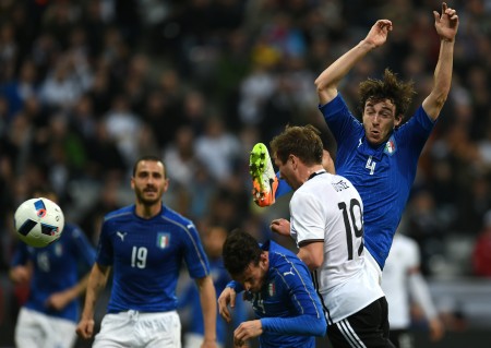 Germany's forward Mario Goetze (2nd R) scores past Italy´s midfielder Alessandro Florenzi (C) and Italy's defender Matteo Darmian (R) during the friendly football match Germany vs Italy in Munich, southern Germany on March 29, 2016. / AFP / PATRIK STOLLARZ (Photo credit should read PATRIK STOLLARZ/AFP/Getty Images)