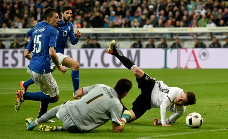 MUNICH, GERMANY - MARCH 29: Gianluigi Buffon of Italy challenges Sebastian Rudy of Germany in the penalty box during the International Friendly match between Germany and Italy at Allianz Arena on March 29, 2016 in Munich, Germany. (Photo by Stuart Franklin/Bongarts/Getty Images)