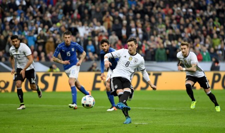 MUNICH, GERMANY - MARCH 29: Mesut Oezil of Germany scores his teams fourth goal from the penalty spot during the International Friendly match between Germany and Italy at Allianz Arena on March 29, 2016 in Munich, Germany. (Photo by Matthias Hangst/Bongarts/Getty Images)