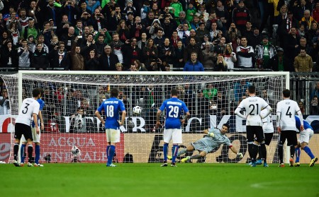 MUNICH, BAVARIA - MARCH 29: Mesut Oezil of Germany scores a penalty goal past Gianluigi Buffon of Italy during the International Friendly match between Germany and Italy at Allianz Arena on March 29, 2016 in Munich, Germany. (Photo by Dennis Grombkowski/Bongarts/Getty Images)