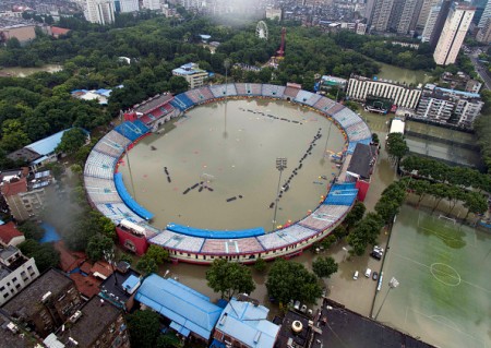 TOPSHOT - This picture taken on July 6, 2016 shows the flooded Xinhua Road Sports Centre Stadium in Wuhan, central China's Hubei province. Heavy rain around China's Yangtze river basin has left 128 people dead and scores missing, media said on July 5, with more damage feared from a typhoon expected to land this week. / AFP / STR / China OUT (Photo credit should read STR/AFP/Getty Images)