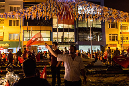 ANTALYA, TURKEY - JULY 16: People take to the street in support of President Recep Tayyip Erdogan July 16, 2016 in Antalya, Turkey. Reports have suggested that a group within Turkey's military have attempted to overthrow the government. Security forces have been called in as Turkey's Prime Minister Binali Yildirim denounced an 'illegal action' by a military 'group', with bridges closed in Istanbul and aircraft flying low over the capital of Ankara (Photo by Chris McGrath/Getty Images)