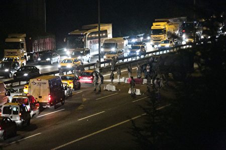 Turkish military control a road in Istanbul on July 16, 2016, after Turkish troops launched a coup. Turkish military forces on July 16 opened fire on crowds gathered in Istanbul following a coup attempt, causing casualties, an AFP photographer said. The soldiers opened fire on grounds around the first bridge across the Bosphorus dividing Europe and Asia, said the photographer, who saw wounded people being taken to ambulances. / AFP / GURCAN OZTURK (Photo credit should read GURCAN OZTURK/AFP/Getty Images)
