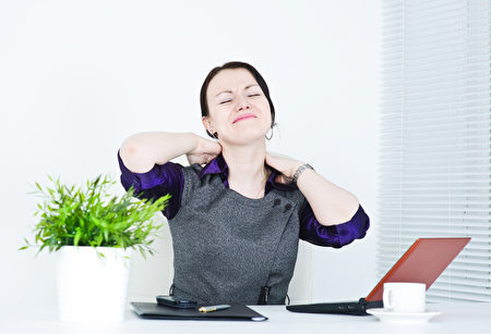 Business woman with pain in her neck Business woman with pain in her neck