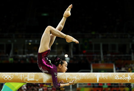 RIO DE JANEIRO, BRAZIL - AUGUST 09: Yan Wang of China competes on the balance beam during the Artistic Gymnastics Women's Team Final on Day 4 of the Rio 2016 Olympic Games at the Rio Olympic Arena on August 9, 2016 in Rio de Janeiro, Brazil. (Photo by Lars Baron/Getty Images)