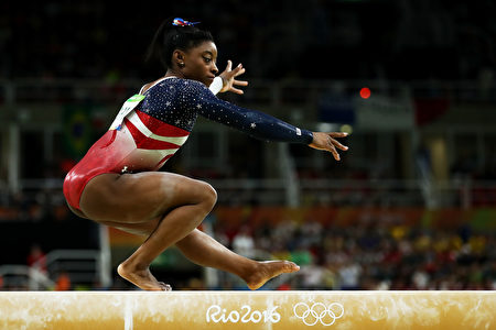 RIO DE JANEIRO, BRAZIL - AUGUST 09: Simone Biles of the United States competes on the balance beam during the Artistic Gymnastics Women's Team Final on Day 4 of the Rio 2016 Olympic Games at the Rio Olympic Arena on August 9, 2016 in Rio de Janeiro, Brazil. (Photo by Lars Baron/Getty Images)