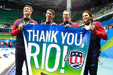 RIO DE JANEIRO, BRAZIL - AUGUST 13: Gold medalists Nathan Adrian, Michael Phelps, Ryan Murphy and Cody Miller of the United States thank the crowd during the medal ceremony for the Men's 4 x 100m Medley Relay Final on Day 8 of the Rio 2016 Olympic Games at the Olympic Aquatics Stadium on August 13, 2016 in Rio de Janeiro, Brazil. (Photo by Adam Pretty/Getty Images)