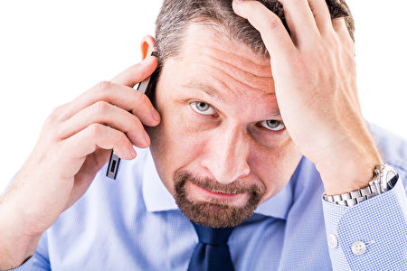 Stressed businessman making a phone call.(fotolia) Stressed businessman making a phone call.(fotolia)