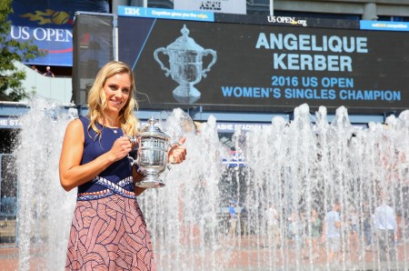 NEW YORK, NY - SEPTEMBER 11: The 2016 US Open Women's Singles champion Angelique Kerber of Germany poses with her trophy by the fountains in the south plaza on Day Fourteen of the 2016 US Open at the USTA Billie Jean King National Tennis Center on September 11, 2016 in the Queens borough of New York City. (Photo by Mike Stobe/Getty Images for USTA)