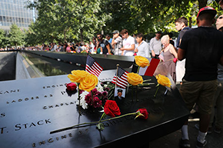 NEW YORK, NY - SEPTEMBER 11: People gather at one of the pools at the National September 11 Memorial following a morning commemoration ceremony for the victims of the terrorist attacks fifteen years after the day on September 11, 2016 in New York City. Throughout the country services are being held to remember the 2,977 people who were killed in New York, the Pentagon and in a field in rural Pennsylvania. (Photo by Spencer Platt/Getty Images)