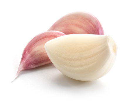Garlic cloves isolated on white background.(shutterstock)