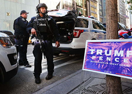 NEW YORK, NY - NOVEMBER 08: Counterterrorism police patrol near Trump Tower on Election Day on November 8, 2016 in New York City. Throughout the country, millions of Americans are casting their votes today for either Hillary Clinton or Donald Trump to become the 45th president of the United States. (Photo by Spencer Platt/Getty Images)