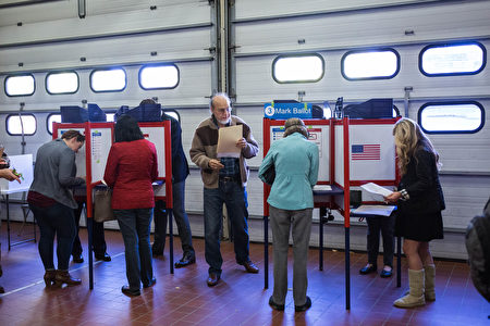 ARLINGTON, VA - NOVEMBER 08: People cast ballots for the 2016 election at Fire Station 10 on November 8, 2016 in Arlington, Virginia. Americans across the nation are picking their choice for the next president of the United States. (Photo by Zach Gibson/Getty Images)