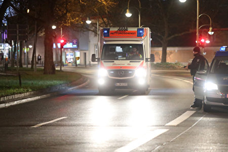 BERLIN, GERMANY - DECEMBER 19: An ambulance drives near the area after a lorry truck ploughed through a Christmas market on December 19, 2016 in Berlin, Germany. Several people have died while dozens have been injured as police investigate the attack at a market outside the Kaiser Wilhelm Memorial Church on the Kurfuerstendamm and whether it is linked to a terrorist plot. (Photo by Sean Gallup/Getty Images)
