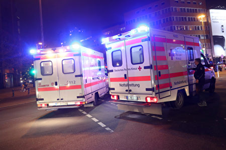 BERLIN, GERMANY - DECEMBER 19: Ambulances are parked near the area after a lorry truck ploughed through a Christmas market on December 19, 2016 in Berlin, Germany. Several people have died while dozens have been injured as police investigate the attack at a market outside the Kaiser Wilhelm Memorial Church on the Kurfuerstendamm and whether it is linked to a terrorist plot. (Photo by Sean Gallup/Getty Images)
