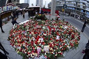 Candles, flowers and individual messages are placed at a makeshift memorial for the victims of the Christmas market attack near the Kaiser-Wilhelm-Gedaechtniskirche (Kaiser Wilhelm Memorial Church) in Berlin on December 22, 2016. The Berlin Christmas market that was struck by a deadly truck rampage on December 19, 2016 reopened, as the grieving city sought a return to normal life and police hunted for the prime suspect in the attack. / AFP / Tobias SCHWARZ (Photo credit should read TOBIAS SCHWARZ/AFP/Getty Images)