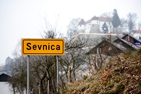 TO GO WITH AFP STORY BY BOJAN KAVCIC A road sign reading 'Sevnica' is seen on December 20, 2016 at the entrance to Sevnica, Slovenia, the home town of future US First Lady Melania Trump. Golden 