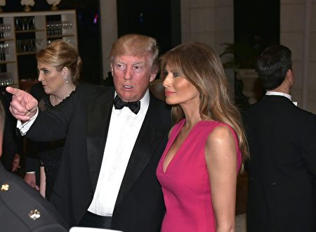 US President Donald Trump and First Lady Melania Trump arrive for the 60th Annual Red Cross Gala at his Mar-a-Lago estate in Palm Beach on February 4, 2017. / AFP / MANDEL NGAN (Photo credit should read MANDEL NGAN/AFP/Getty Images)