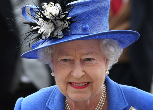 EPSOM, ENGLAND - JUNE 02: Queen Elizabeth II arrives at The Derby on June 2, 2012 in Epsom, England. For only the second time in its history, the UK celebrates the Diamond Jubilee of a monarch. Her Majesty Queen Elizabeth II celebrates the 60th anniversary of her ascension to the throne. Thousands of wellwishers from around the world have flocked to London to witness the spectacle of the weekend's celebrations. The Queen along with all the members of the royal family will participate in a River Pageant with a flotilla of 1,000 boats accompanying them down the Thames, a star studded free concert at Buckingham Palace, and a carriage procession and a Service of Thanksgiving at St Paul's Cathedral. (Photo by Peter Macdiarmid/Getty Images)