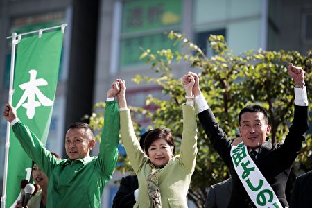In this picture taken on October 18, 2017, Tokyo Governor and leader of the Party of Hope Yuriko Koike (C) raises the hand of party candidate Yoshinori Yoshida (R) during an election campaign in Saitama. Japanese Prime Minister Shinzo Abe appears poised to secure a fresh term at the helm of the world's third-biggest economy Sunday, as he seeks a mandate for his nationalist agenda and hardline stance on North Korea. / AFP PHOTO / Behrouz MEHRI (Photo credit should read BEHROUZ MEHRI/AFP/Getty Images)