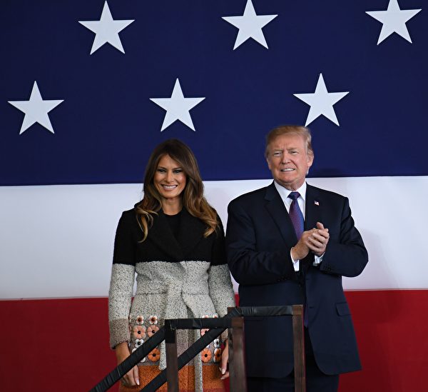 US President Donald Trump (R) and First Lady Melania smile upon arriving at US Yokota Air Base in Tokyo on November 5, 2017. Trump touched down in Japan, kicking off the first leg of a high-stakes Asia tour set to be dominated by soaring tensions with nuclear-armed North Korea. / AFP PHOTO / Toshifumi KITAMURA / The erroneous mention[s] appearing in the metadata of this photo by Toshifumi KITAMURA has been modified in AFP systems in the following manner: [November 5] instead of [November 4]. Please immediately remove the erroneous mention[s] from all your online services and delete it (them) from your servers. If you have been authorized by AFP to distribute it (them) to third parties, please ensure that the same actions are carried out by them. Failure to promptly comply with these instructions will entail liability on your part for any continued or post notification usage. Therefore we thank you very much for all your attention and prompt action. We are sorry for the inconvenience this notification may cause and remain at your disposal for any further information you may require. (Photo credit should read TOSHIFUMI KITAMURA/AFP/Getty Images)