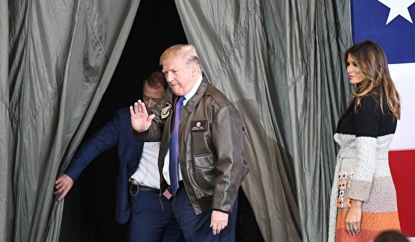 US President Donald Trump waves to US soldiers as his wife Melania looks on upon arriving at US Yokota Air Base in Tokyo on November 5, 2017. Trump touched down in Japan, kicking off the first leg of a high-stakes Asia tour set to be dominated by soaring tensions with nuclear-armed North Korea. / AFP PHOTO / Toshifumi KITAMURA (Photo credit should read TOSHIFUMI KITAMURA/AFP/Getty Images)