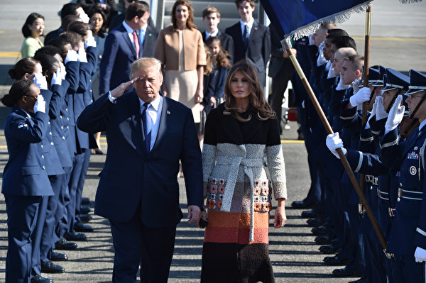 US President Donald Trump (C-L) and his wife Melania (C-R) are welcomed upon arrival at Yokota Air Base in Fussa City, Tokyo prefecture on November 5, 2017. Trump touched down in Japan, kicking off the first leg of a high-stakes Asia tour set to be dominated by soaring tensions with nuclear-armed North Korea. / AFP PHOTO / POOL / Kazuhiro NOGI (Photo credit should read KAZUHIRO NOGI/AFP/Getty Images)
