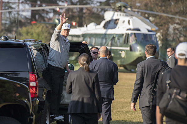 US President Donald Trump (L) waves as he exits his vehicle after playing a round of golf with Japanese Prime Minister Shinzo Abe at the Kasumigaseki Country Club Golf Course in Kawagoe, Saitama prefecture, outside Tokyo on November 5, 2017. Trump touched down in Japan on November 5, kicking off the first leg of a high-stakes Asia tour set to be dominated by soaring tensions with nuclear-armed North Korea. / AFP PHOTO / JIM WATSON (Photo credit should read JIM WATSON/AFP/Getty Images)