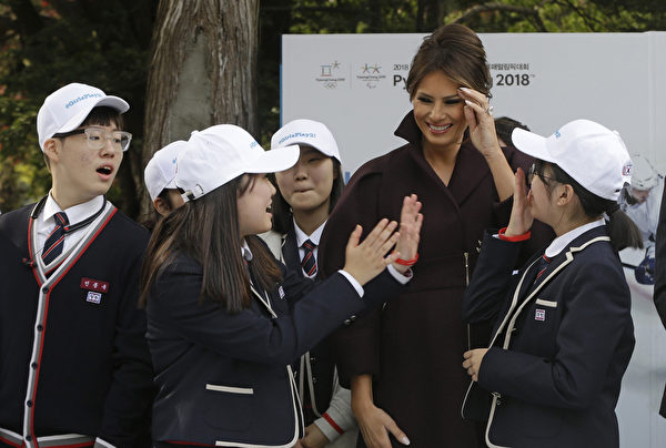 SEOUL, SOUTH KOREA - NOVEMBER 7: U.S. First Lady Melania Trump talks with South Korean middle school students during an event for the "Girls Play 2!" Initiative, an Olympic public diplomacy outreach campaign, at the U.S. Ambassador's Residence on November 7, 2017 in Seoul, South Korea. Melania Trump and U.S. President Donald Trump are visiting South Korea as part of a 13-day tour of Asia. (Photo by Ahn Young-joon - Pool/Getty Images)