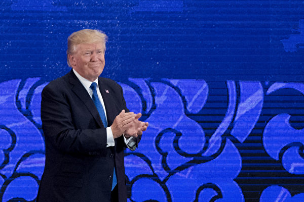 US President Donald Trump applauds during speech on the final day of the APEC CEO Summit, part of the broader Asia-Pacific Economic Cooperation (APEC) leaders' summit, in the central Vietnamese city of Danang on November 10, 2017. World leaders and senior business figures are gathering in the Vietnamese city of Danang this week for the annual 21-member APEC summit. / AFP PHOTO / JIM WATSON (Photo credit should read JIM WATSON/AFP/Getty Images)