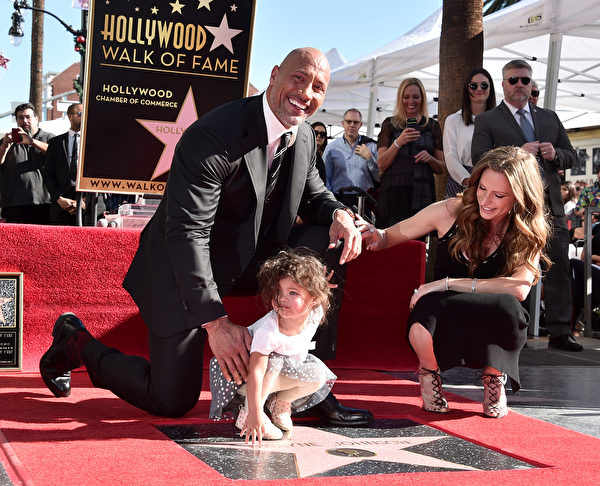 HOLLYWOOD, CA - DECEMBER 13: Actor Dwayne Johnson, Jasmine Johnson and singer Lauren Hashian attend a ceremony honoring Dwayne Johnson with the 2,624th star on the Hollywood Walk of Fame on December 13, 2017 in Hollywood, California. (Photo by Alberto E. Rodriguez/Getty Images)