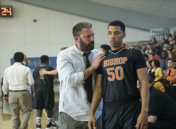 Ben Affleck (L) and Melvin Gregg as coach and player in “The Way Back.” (Warner Bros.)