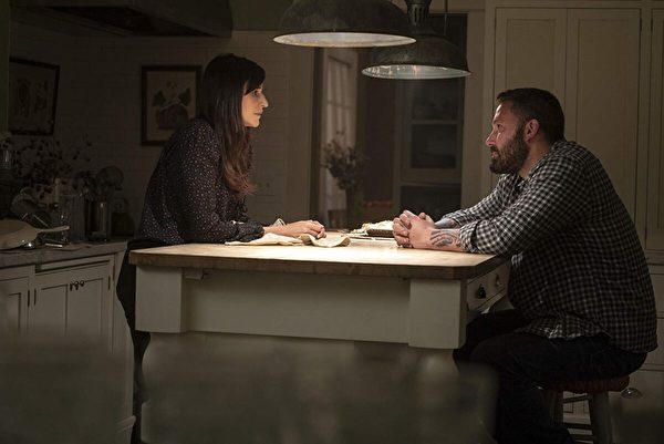 Michaela Watkins and Ben Affleck play brother and sister in “The Way Back.” (Warner Bros.)