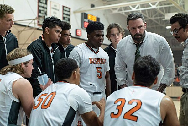 Jack Cunningham (Ben Affleck, 2nd R) coaches his team with vehemence in the high school basketball movie “The Way Back.” (Warner Bros.)