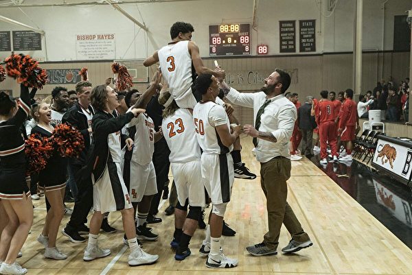 Jack Cunningham (Ben Affleck, R) celebrating a win with his team in the high school basketball movie “The Way Back.” (Warner Bros.)