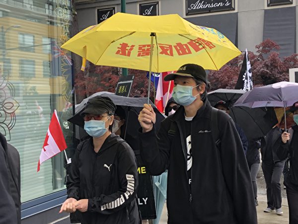 圖：溫哥華逾千人遊行集會，表達對香港手足的聲援，對中共暴政的抵制決心。（邱晨／大紀元）