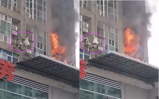 视频：长沙高楼起火 火舌喷出 女子爬绳逃生