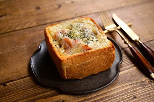 Bread Hollowed Out And Filled With Gratin Sauce And Baked