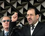 伊拉克总理马利基(右)说，萨达姆受到了公正的审判。(AFP)