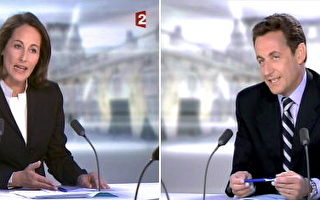 2007 年5月02 日，法國總統大選決選的兩位候選人，賀雅爾（左）與沙柯吉（右）今天展開電視辯論，吸引法國全國民眾關切，許多民眾在各所在場合開起電視看即時轉播。（THIERRY ZOCCOLAN/AFP/Getty Images）