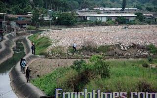 港农地堆放建筑废料 淤塞河道无人理