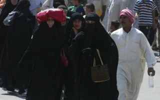 7月28日，什葉派回教徒徒步趕往巴格達一處聖殿參加重要宗教儀式。(ALI YUSSEF/AFP/Getty Images)
