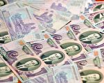 去年北韓政府讓北韓元貶值,以對付通貨膨脹。圖為5,000北韓元鈔票(AFP PHOTO)